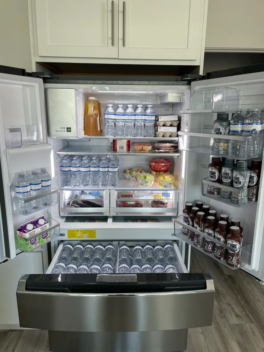 A vacation-rental fridge fully stocked before check-in